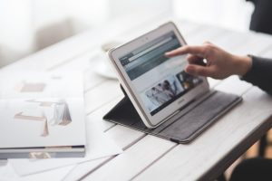 businessman-working-with-tablet-scaled